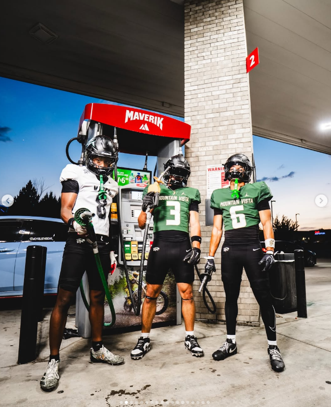 Gas station lineup at dusk, fuel nozzles in hand