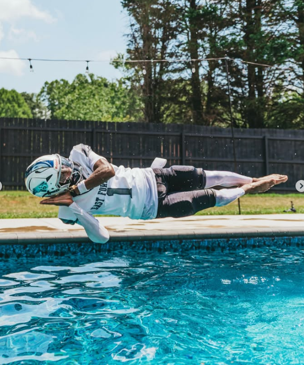 Full-pads dive into a backyard pool