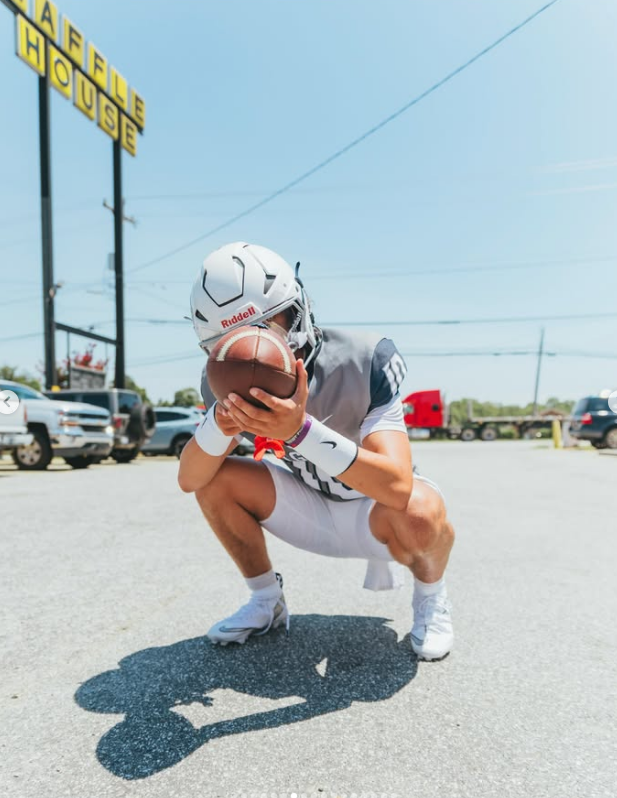 Daylight parking lot pose with sign in frame